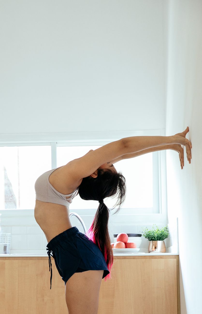 A woman stretching, illustrating that diet and exercise still matter alongside any treatment